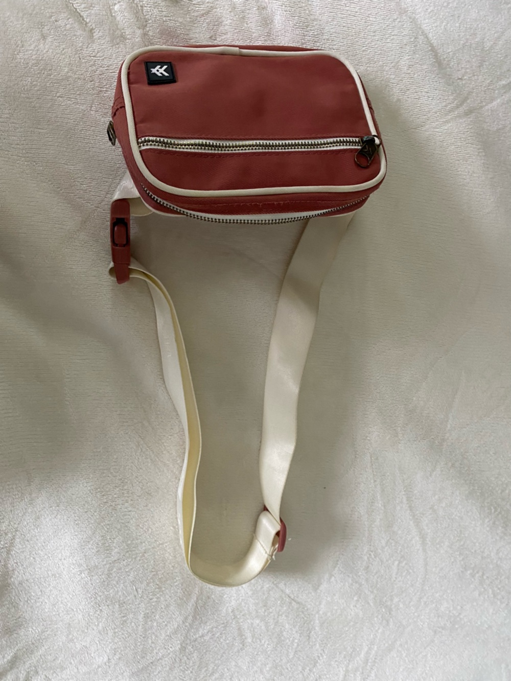 Compact Red Crossbody Bag with Cream Strap and Zip Pockets